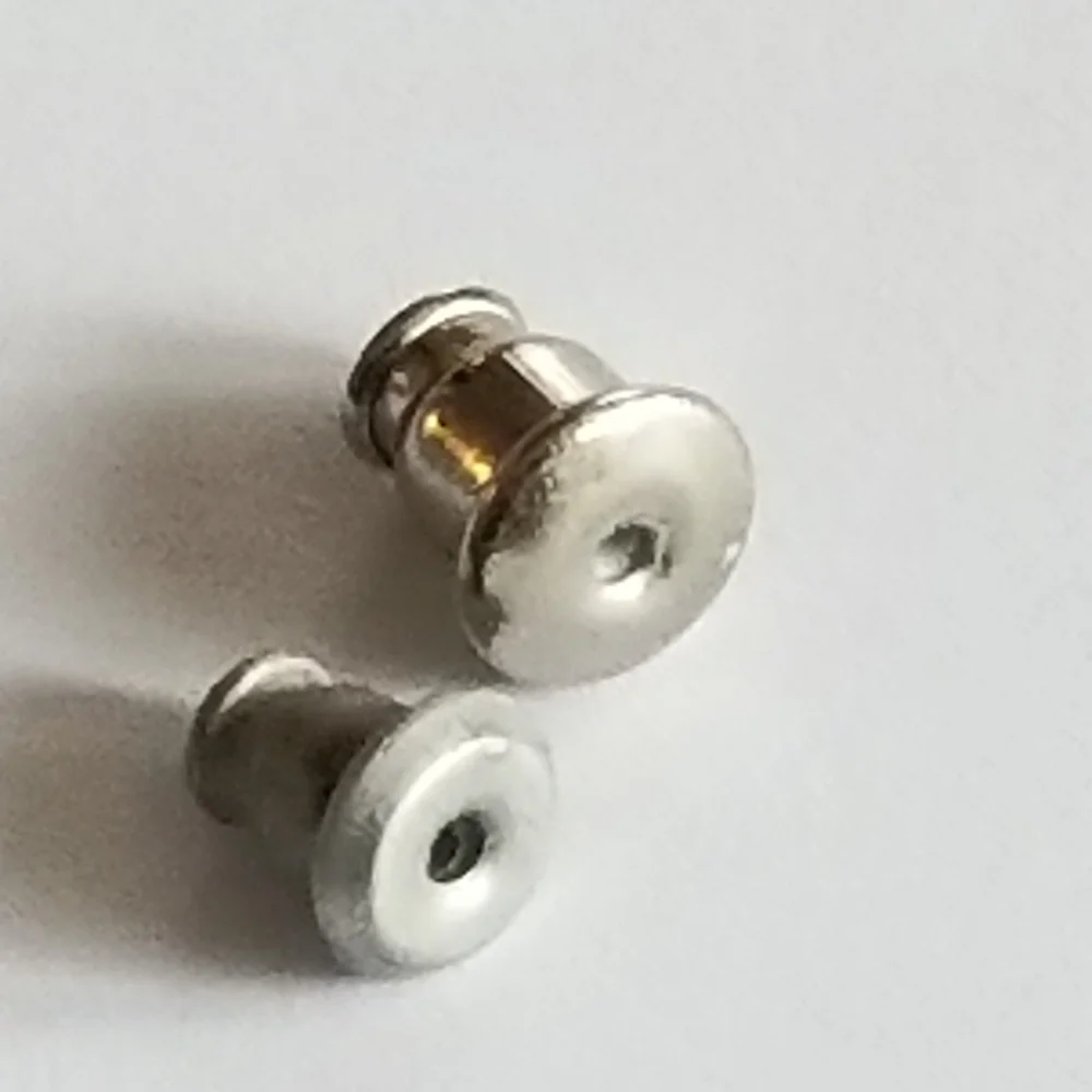 Earrings Silver tone earrings oval stud scrolled design